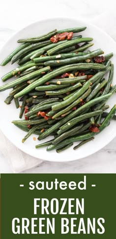 Overhead shot of sauteed greenbeans on a white plate standing on a marble background. Under the image, there is a text overlay saying: Sauteed Frozen Green Beans. Frozen Whole Green Beans, Sautéed Frozen Green Beans, Recipes For Frozen Green Beans, Sauteed Frozen Green Beans, Easy Frozen Green Bean Recipes, Frozen Green Beans With Bacon, How To Cook Frozen Green Beans