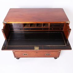 an old fashioned wooden desk with drawers