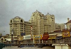 an old photo of a city with tall buildings