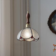 a light hanging from a ceiling in a room