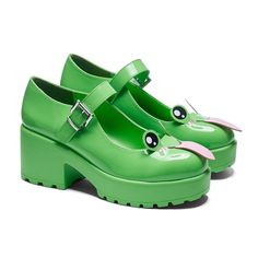 a pair of green shoes with eyeballs on the heel and one shoe has a pink bow