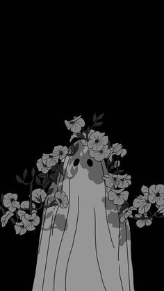 a black and white photo with flowers in the dark, on a cell phone screen