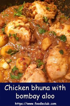 chicken bhuna with bombay aloo in a pan