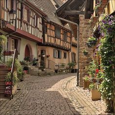 a cobblestone street in an old european village