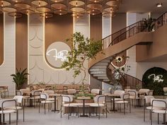 the interior of a restaurant with tables, chairs and plants on the wall next to stairs