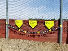 there is a fence that has some signs on it