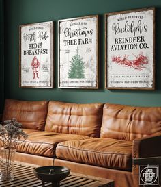 a living room with leather couches and two posters on the wall above them that say christmas tree farm