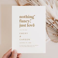 a person holding up a card with the words nothing fancy just love