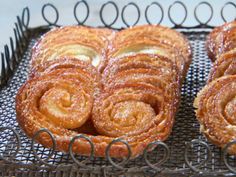 two pastries sitting on top of a cooling rack