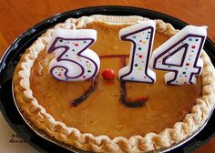 a birthday cake with candles in the shape of numbers