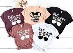 four shirts that say princess security with mickey mouse ears