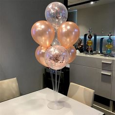 a table with some balloons on top of it