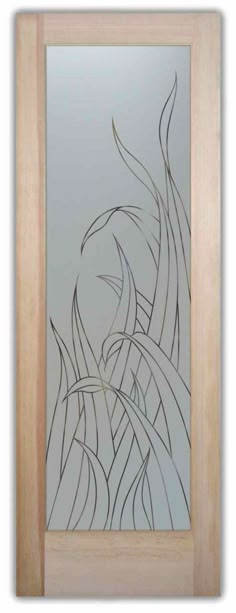 a glass door with an artistic design on the front and side panels in wood frame