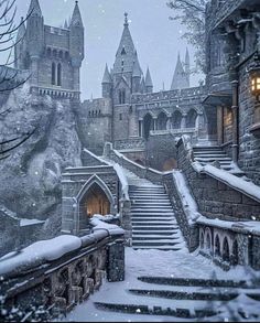 an image of a castle in the snow with stairs leading up to it's entrance