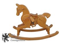 a wooden rocking horse on a white background