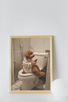 a teddy bear sitting on top of a toilet