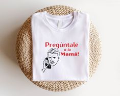 Preguntale A Tu Mama Mexican Father T-Shirt, Dia Del Padre Shirt, Latino Dad Sweatshirt, Spanish Father's Day Tee, Mexican Dad Shirt How Do I Order 1) Before you place the order, please review all the information. 2) From the drop down menu, chose your shirt type and size. 3) From the drop down menu, chose the color of the shirt. 4) If you need more items, add the item you like in the cart first then click the back button and follow the steps 1-4 again. Washing Wash the inside of the t-shirts in cold water, do not bleach, do not dry clean, do not iron directly on the design 🙏Thank You For Supporting Our Small Business🙏  Note: Product and design color may slightly vary due to photographic lighting sources or your monitor settings. White Tops With Funny Print For Gift, Funny White Tops As Gifts, Mother's Day White Shirt With Screen Print, Funny Print Shirt As A Mother's Day Gift, Funny Text Shirt For Mother's Day Gift, Mother's Day Gift Shirt With Funny Text, Funny White T-shirt As Gift, Funny White T-shirt For Gift, Funny White T-shirt Gift