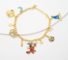 With a wave of your wrist, the enchanting universe of Disney's Fantasia comes to life. Each enameled charm on this Sorcerer Mickey bracelet is intricately detailed and will leave you spellbound. Mickey Bracelet, Disney Charm Bracelet, Disney Fantasia, Disney Charm, Sorcerer Mickey, Fantasia Disney, Disney Charms, Kids Necklace, Enamel Charms