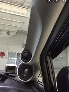 the interior of a car with speakers in it