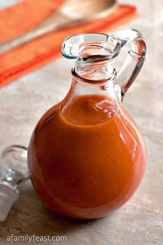 a caramel colored liquid in a glass pitcher