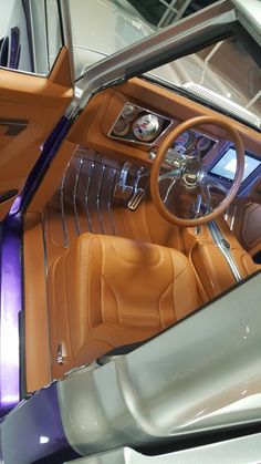 the interior of an old car with leather seats