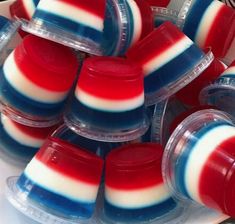 red, white and blue jellopops sitting on top of each other in plastic containers