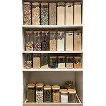 an organized pantry filled with lots of different types of food and seasonings on shelves