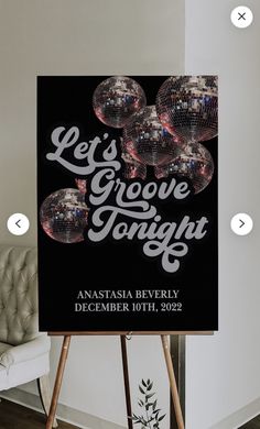 a black and white sign that says let's groove tonight on it with disco balls in the background