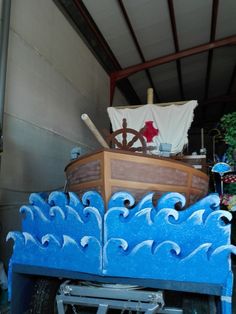 an old fashioned wooden boat is painted blue