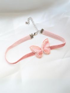 Life is just more magical with our pink butterfly choker necklace. Made for princesses, little ladies, and fashion-loving girls, this must-have accessory is as lovable as your cutie pie.   Clasp and chain link closure offer an adjustable fit that feels comfy even for all-day wear. Just the thing to complete multiple costumes, formal dresses, and make-believe outfits  Pink choker necklace with butterfly accent and clasp closure  Includes one necklace in one size that fits most toddlers and young girls Not intended for sleepwear. Please supervise the child while they are wearing the accessory. Cute Adjustable Pink Necklaces, Cute Adjustable Choker Jewelry, Cute Adjustable Choker For Parties, Adjustable Cute Pink Choker, Valentine's Day Pink Adjustable Necklace, Cute Adjustable Pink Jewelry, Pink Adjustable Choker As A Gift, Adjustable Pink Butterfly Jewelry, Cute Butterfly Necklace For Gift