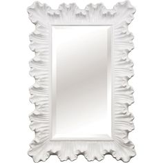 a white wall mirror with scalloped edges