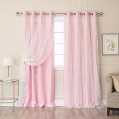 a living room with a couch and pink curtains