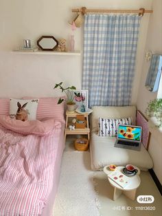 a room with a bed, chair and desk in it that has a laptop on the table