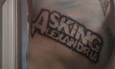 a man's arm with the words asking alexandria written on it in black ink