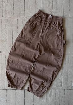 FOLLOW MY SHOP TO CHECK DAILY UPDATES & PRICE DROPS Vintage BDG Carpenter Work Pants in Brown Relaxed baggy parachute type pants. 5 pocket design. Cargo pockets on both legs. Elastic waist Size XS Waist (1/2) - 12'' Length - 27'' Leg Opening - 7.5'' Pants are in very good pre-owned condition. Please check pictures for more information on the product Shipping options: - standard shipping in 7-15 days - priority in 3-5 business days (price will be more)   Check out my other items & follow - new ar Brown Parachute Pants With Pockets For Streetwear, Streetwear Brown Parachute Pants With Pockets, Brown Full-length Parachute Pants For Streetwear, Brown Wide-leg Parachute Pants With Side Pockets, High-waist Brown Parachute Pants With Pockets, Carpenter Work, Pants Brown, Baggy Pant, Work Pants