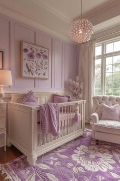 a baby's room with purple and white decor