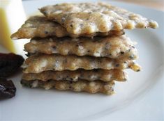 a stack of crackers sitting on top of a white plate