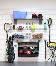 there is a rack with various sports equipment on it