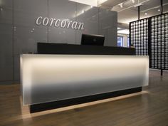 the reception desk is clean and ready to be used for business purposes in this modern office