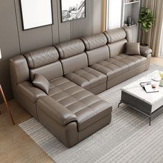 a modern living room with leather couches and coffee table