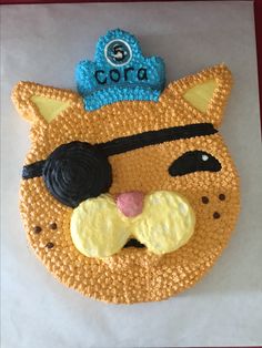 a cake made to look like a cat with a crown on it's head