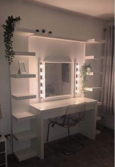 a white desk sitting under a mirror in a room