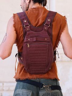 Discover the Enigma Ninja Bag - the ultimate backpack that blends style with practicality! Crafted from durable cotton canvas, this versatile bag features a unique aesthetic and comes in two colors: brown and maroon. It's practical too, boasting three spacious compartments and ample storage to ensure a secure and hassle-free experience. Now that's ninja-level organization! Cotton Canvas Backpack With Pockets, Outdoor Canvas Chest Bag With Pockets, Outdoor Cotton Shoulder Bag Backpack, Brown Festival Backpack Bag, Brown Cotton Backpack With Pockets, Hippie Handmade Shoulder Bag For Festival, Hippie Shoulder Bag With Adjustable Strap, Hippie Festival Shoulder Bag With Adjustable Strap, Hippie Festival Shoulder Bag