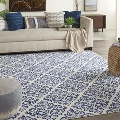 a blue and white rug in a living room