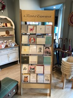 a display case filled with lots of cards and knick - knacks in a store