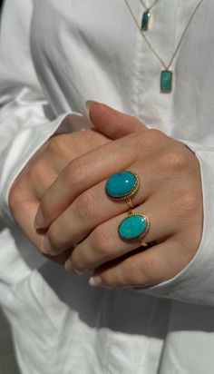 Our unique genuine turquoise rings are 14k solid gold. They have oval-cut natural turquoise stones and unique and also simple designs that look charming. There are 2 different stone styles available on these boho-style rings. The genuine turquoise stone on the ring, believe in that it has a healing quality, and calming effect, brings good fortune, protects against evilness, and so on. Since the back of the stone is left open, it will come into contact with your skin from this part and transfer these effects to you 🤗 Style 1's length of the stone is approx. is 17.44 mm, the width of the stone is 13.68mm, the height of its band is 2.00 mm and the thickness of the band is 1.00 mm. The height of the stone is approx. 5.75 mm. Style 2's length of the stone is approx. is 15.97 mm, the width of t Oval Yellow Gold Turquoise Ring, Gold Oval Turquoise Ring Gift, Unique Turquoise Ring With Natural Stones, Oval Turquoise Ring In Yellow Gold, Turquoise Oval Rings With Natural Stones, Adjustable Gold Turquoise Ring With Oval Shape, Oval Gold Turquoise Ring Gift, Oval Turquoise Rings With Natural Stones, Oval Turquoise Rings In 14k Gold