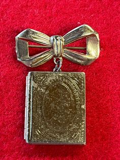 This simple but beautiful little pin is a double sided locket in the shape of a book. It opens on a hinge and has just enough room for 2 tiny photos. The pin measures almost 1.25 inches across and 1.5 inches tall. It is in pretty good condition (please see photos) and displays well with some wear and scratching.  ES SHIPPING INFORMATION: We usually ship in 2-3 days of getting a cleared payment. Tracking is included in our shipping price. If the shipping turns out to be cheaper than what we quoted you... we will refund the difference over $1. We also offer free local pick-up... in most situations. Please ask about this if you are interested. We ship almost exclusively through the USPS, since they seem to have the best rates. If you need another shipping company, please let us know. Internat Queens Jewels, Book Jewelry, This Is Us Quotes, Vintage Pins, Double Face, Pretty Good, A Book, Locket, Costume Jewelry