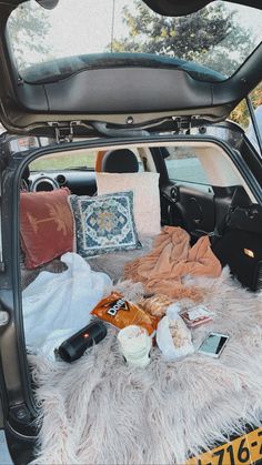 the trunk of a car filled with items