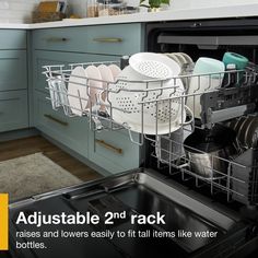 the dishwasher is full of dishes and has two racks for it to hold them