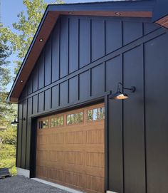 a large garage with two doors on the front and one door open to let in light